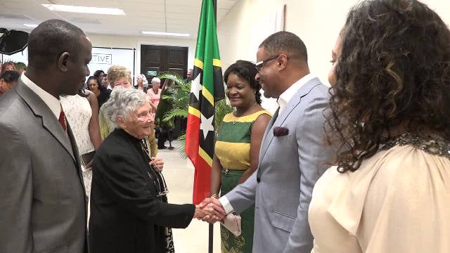 Acting Premier of Nevis Hon. Mark Brantley flanked by (right) wife of Premier Hon. Vance Amory Mrs. Verni and (left) his wife Mrs. Sharon Brantley, meets with Accomplished British historian and author Dr. June Goodfield at the premier showing of her film “The Time Detective” based on her novel “Rivers of Time” at the Social Security’s conference room at Pinney’s on January 14, 2017, at a VIP event hosted by the Ministry of Tourism, in collaboration with Dr. Goodfield and the British Broadcasting Corporation. Looking on are John Hanley, Assistant Secretary in the Ministry of Tourism (in the foreground) and the film’s Production Manager Helen Kidd